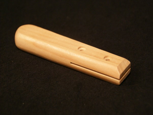 Wood Tool Handle with two counter bored holes and slotting.
